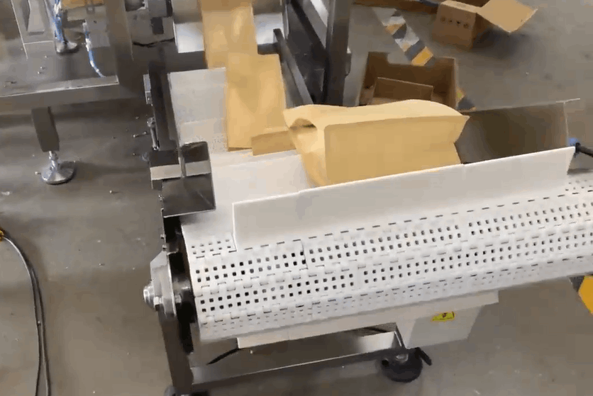 Final Product Discharge Conveyor of 4-station bag packing machine